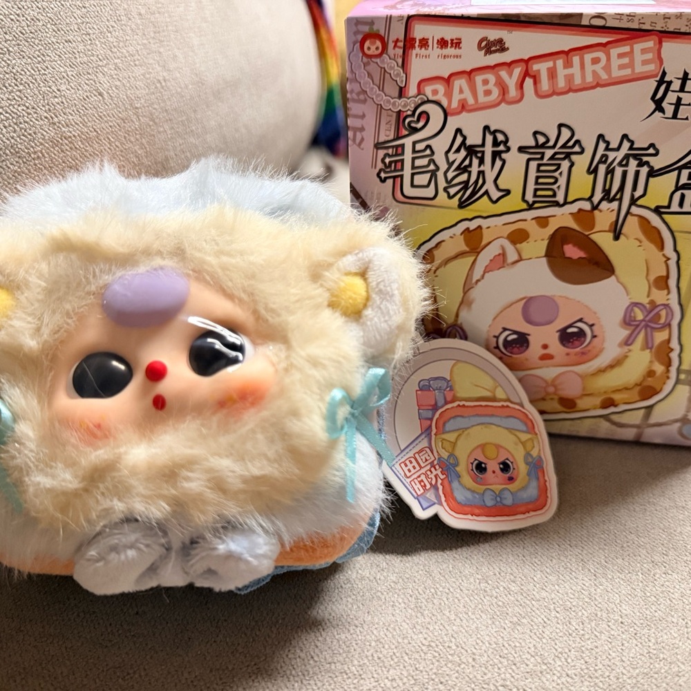 Plush Toy with Blue and Cream Accents